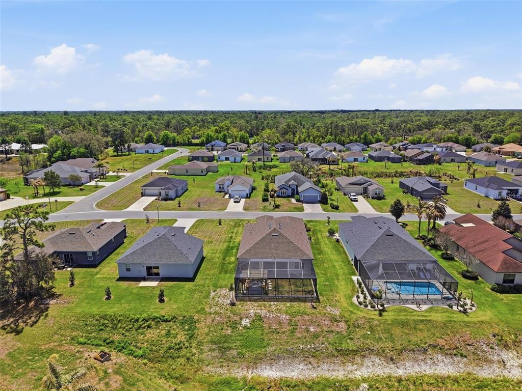 9013 Mississippi Run Weeki Wachee, FL 34613 - Photo 75 of 99 an aerial view of residential houses with outdoor space and trees