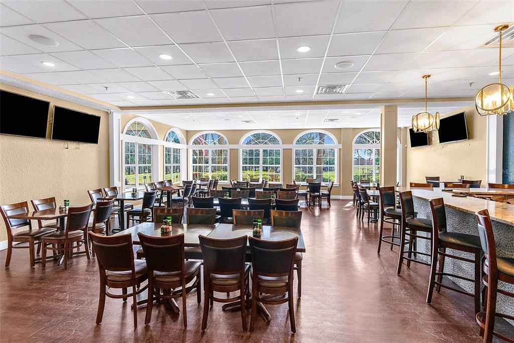 9013 Mississippi Run Weeki Wachee, FL 34613 - Photo 85 of 99 a very nice looking dining room with furniture and a large window