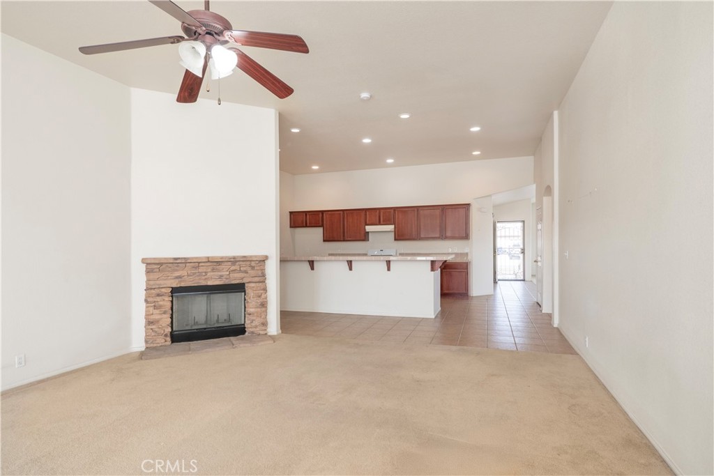 21189 Colombard Way Apple Valley, CA 92308 - Photo 12 of 48 an entryway and a livingroom with a fireplace