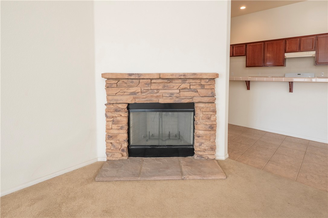 21189 Colombard Way Apple Valley, CA 92308 - Photo 14 of 48 a living room with a fireplace