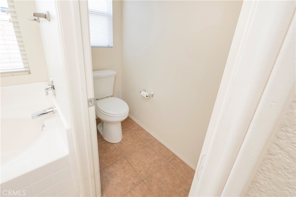 21189 Colombard Way Apple Valley, CA 92308 - Photo 20 of 48 a bathroom with a toilet and a shower