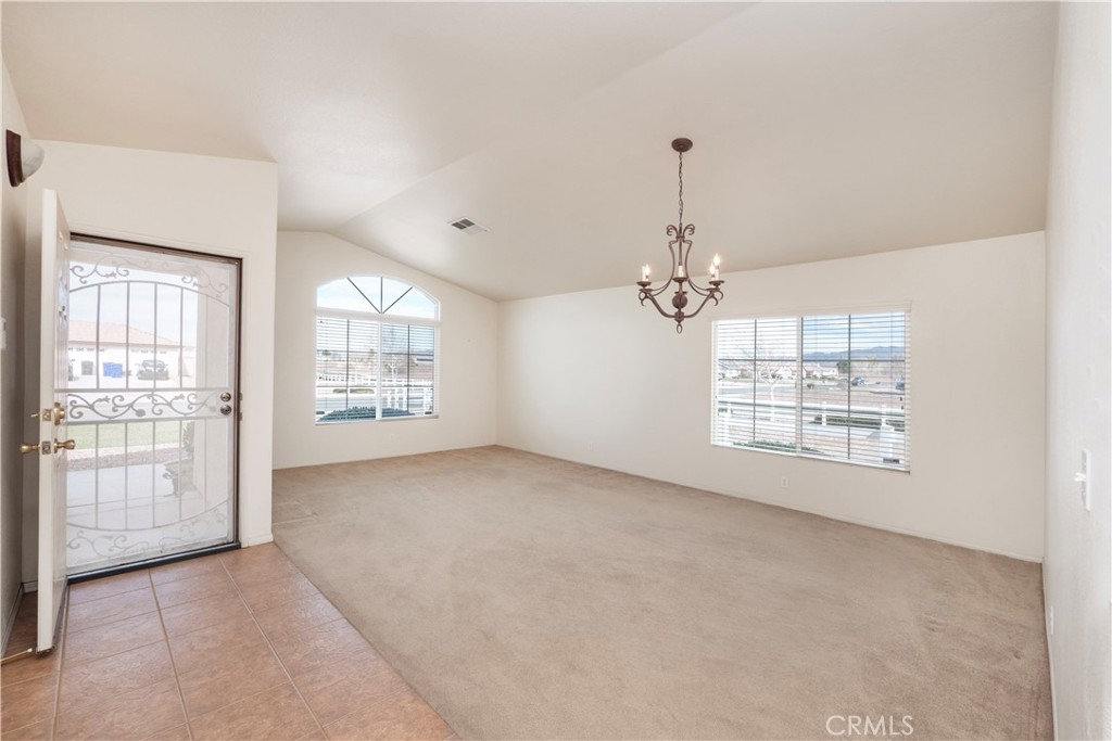 21189 Colombard Way Apple Valley, CA 92308 - Photo 2 of 48 a view of an empty room with a window
