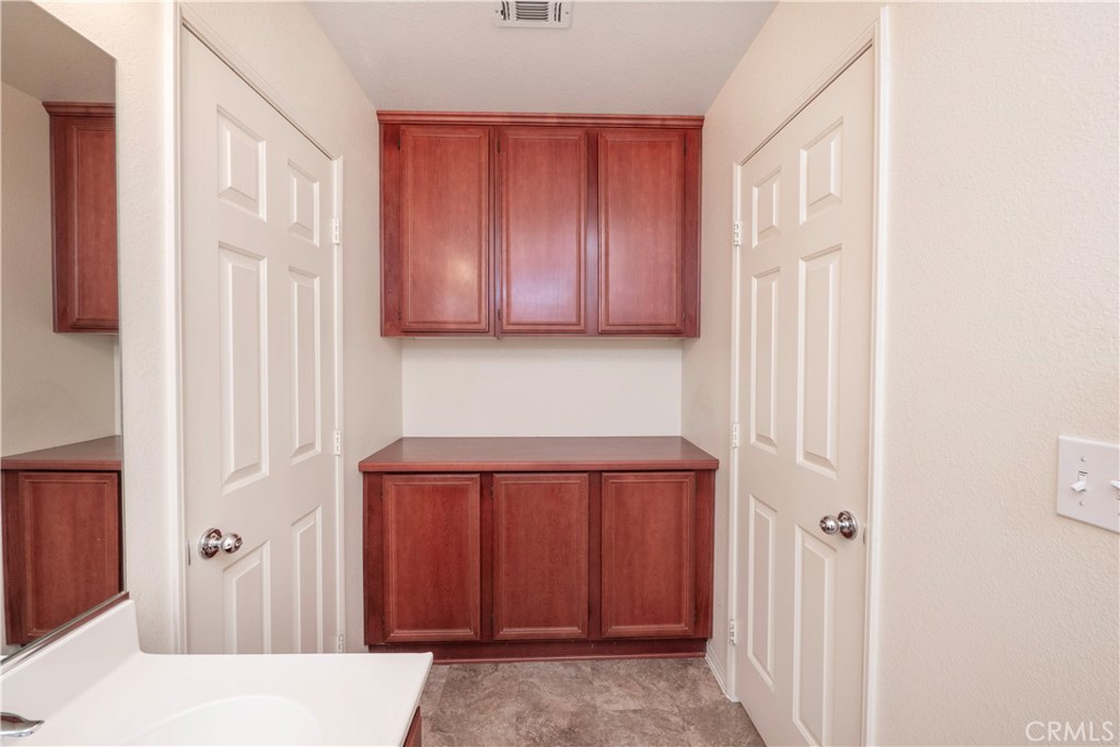21189 Colombard Way Apple Valley, CA 92308 - Photo 22 of 48 a view of a hallway with closet