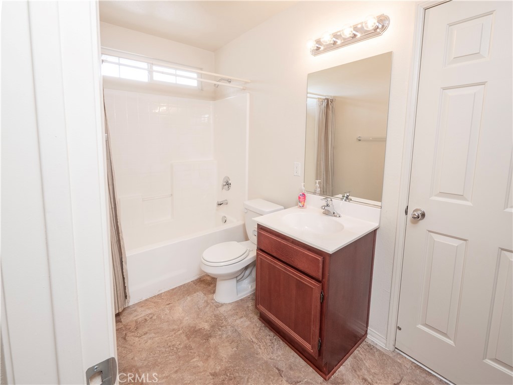 21189 Colombard Way Apple Valley, CA 92308 - Photo 26 of 48 a bathroom with a sink a toilet and shower