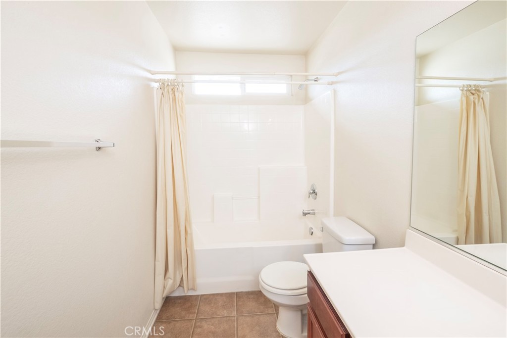 21189 Colombard Way Apple Valley, CA 92308 - Photo 29 of 48 a bathroom with a shower toilet and sink