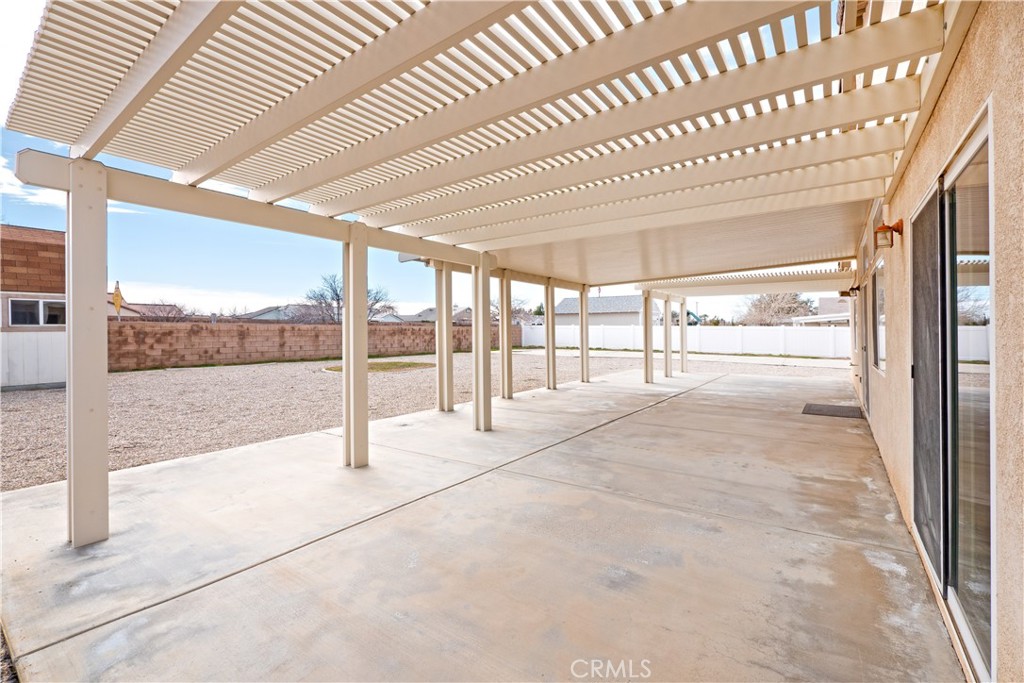 21189 Colombard Way Apple Valley, CA 92308 - Photo 40 of 48 a view of an empty room with a balcony