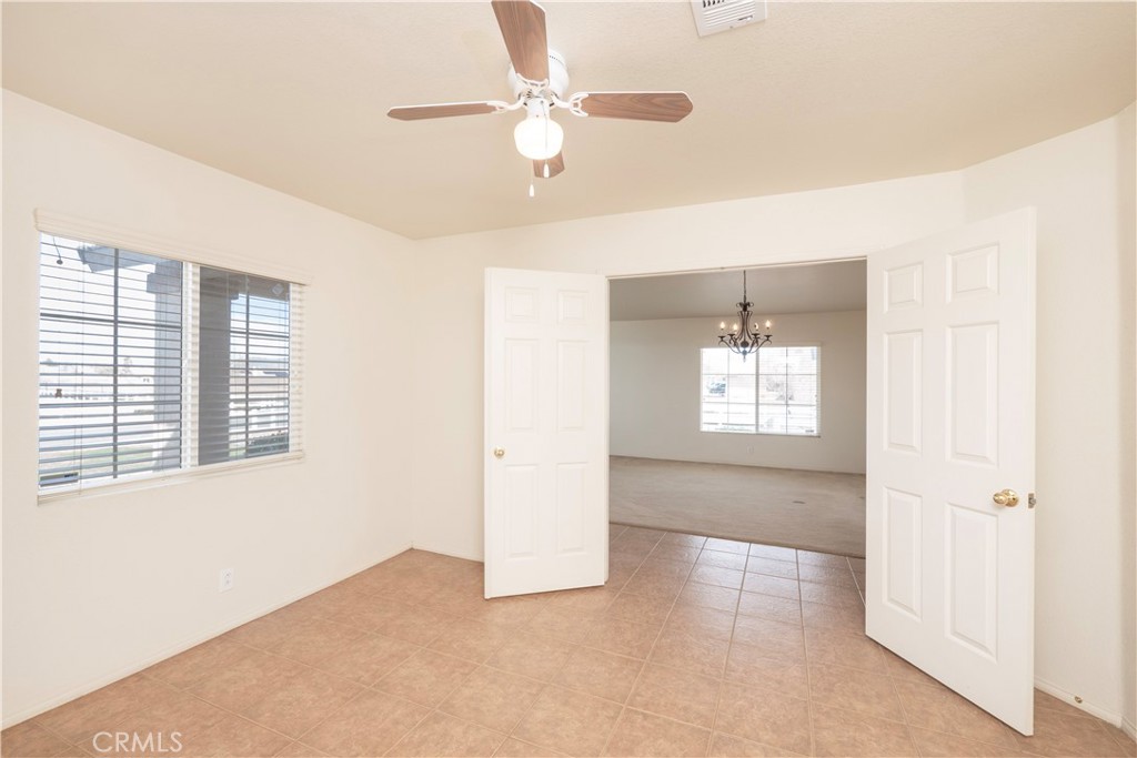 21189 Colombard Way Apple Valley, CA 92308 - Photo 4 of 48 a view of an empty room with a window