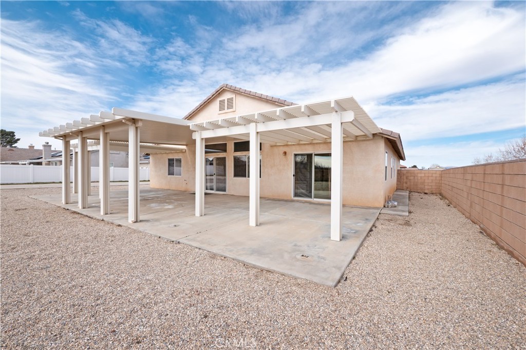 21189 Colombard Way Apple Valley, CA 92308 - Photo 43 of 48 a view of a house with a backyard