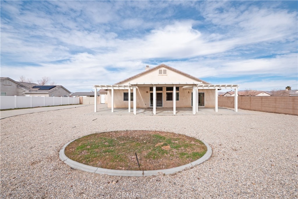 21189 Colombard Way Apple Valley, CA 92308 - Photo 44 of 48 a view of a house with a backyard