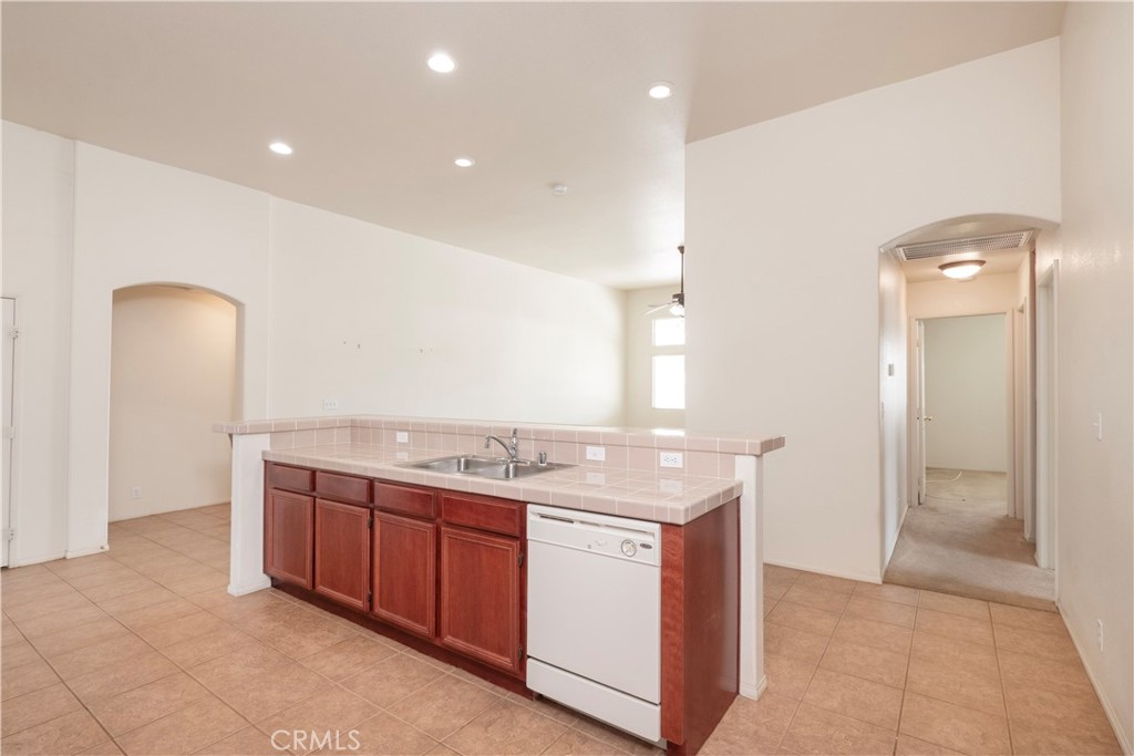 21189 Colombard Way Apple Valley, CA 92308 - Photo 10 of 48 a bathroom with a granite countertop sink and a mirror