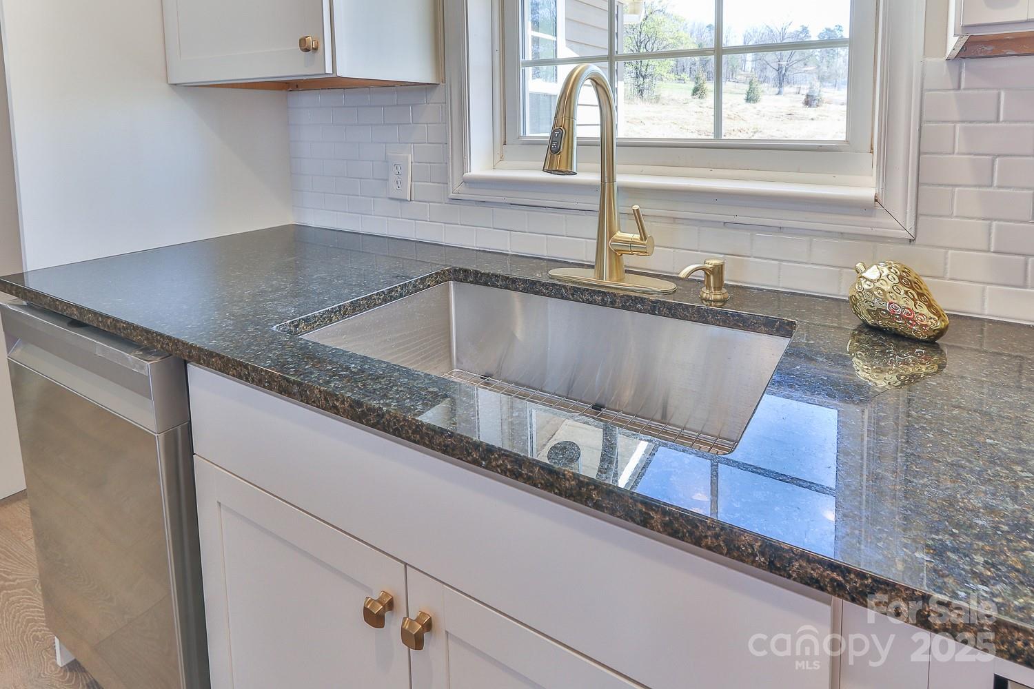 3424 Walker Circle Lenoir, NC 28645 - Photo 19 of 38 a kitchen with a sink and a window