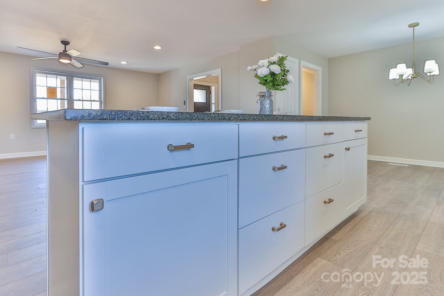 3424 Walker Circle Lenoir, NC 28645 - Photo 20 of 38 a bathroom with a granite countertop double vanity sink and a mirror