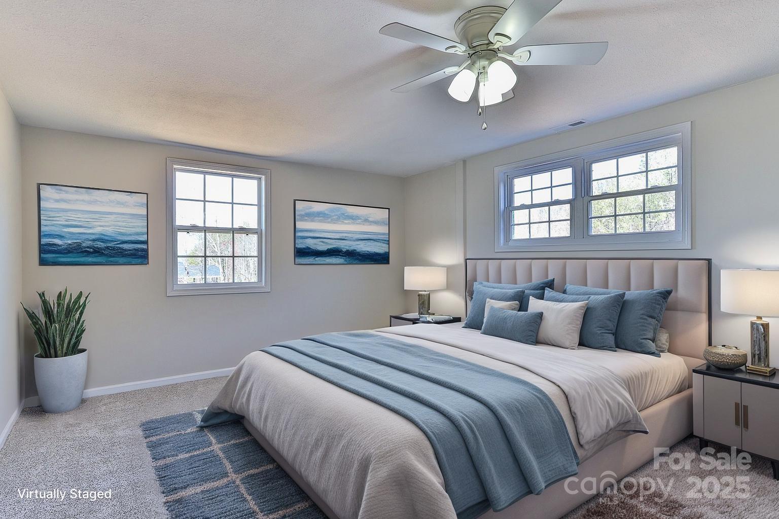 3424 Walker Circle Lenoir, NC 28645 - Photo 24 of 38 a bedroom with a bed and a chandelier