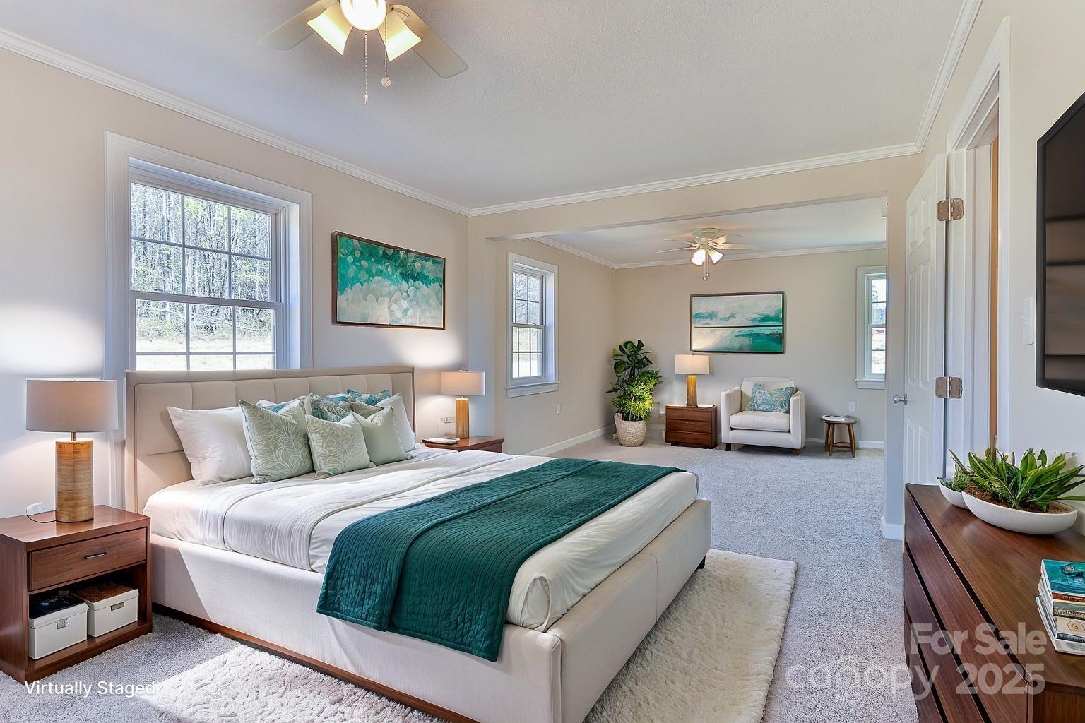 3424 Walker Circle Lenoir, NC 28645 - Photo 26 of 38 a spacious bedroom with a balcony a bed and a chandelier