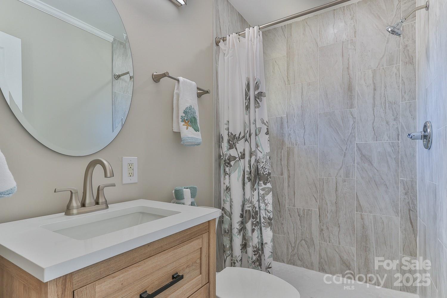 3424 Walker Circle Lenoir, NC 28645 - Photo 27 of 38 a bathroom with a sink toilet and shower