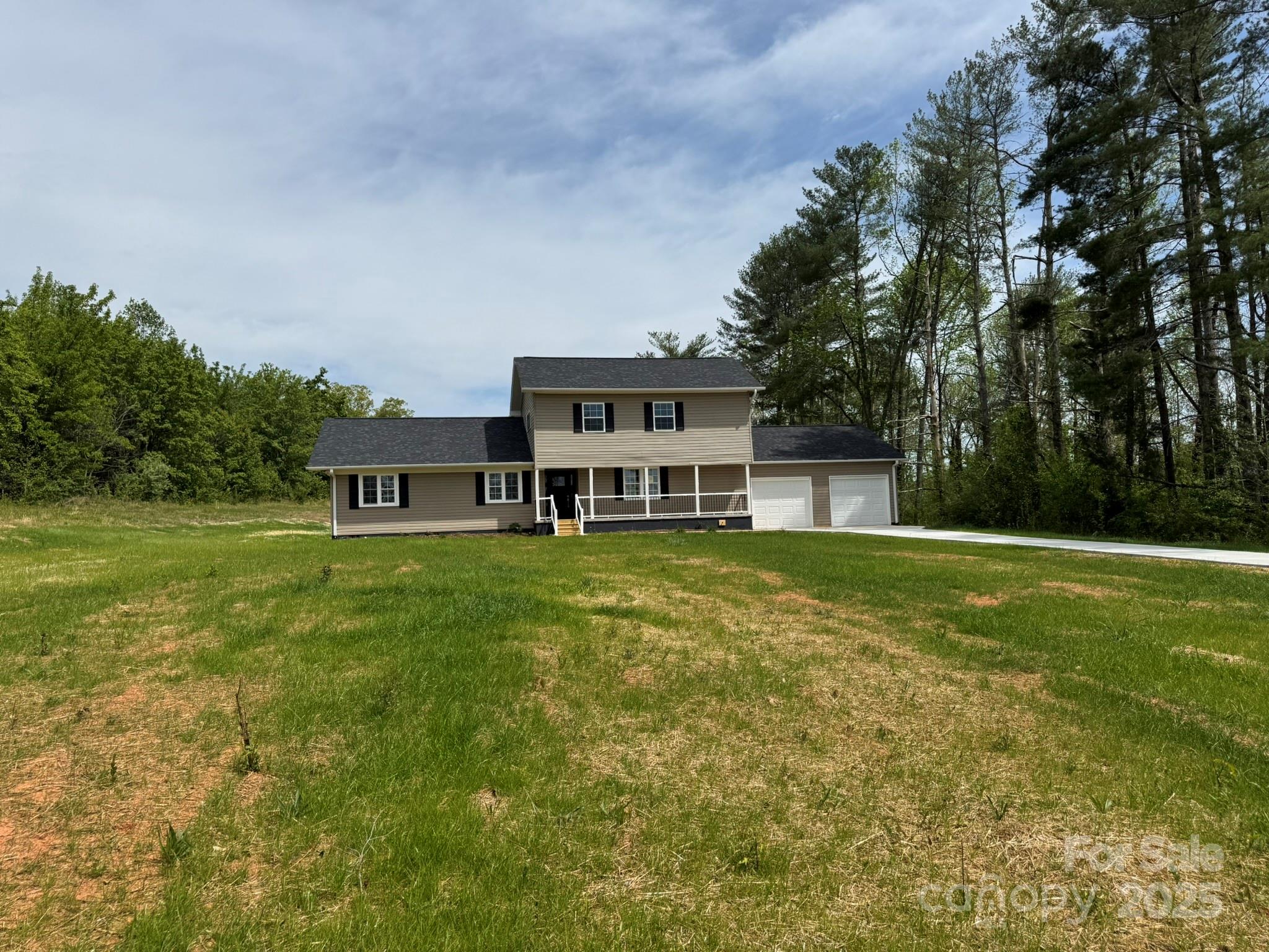 3424 Walker Circle Lenoir, NC 28645 - Photo 3 of 38 a front view of a house with a yard table and chairs