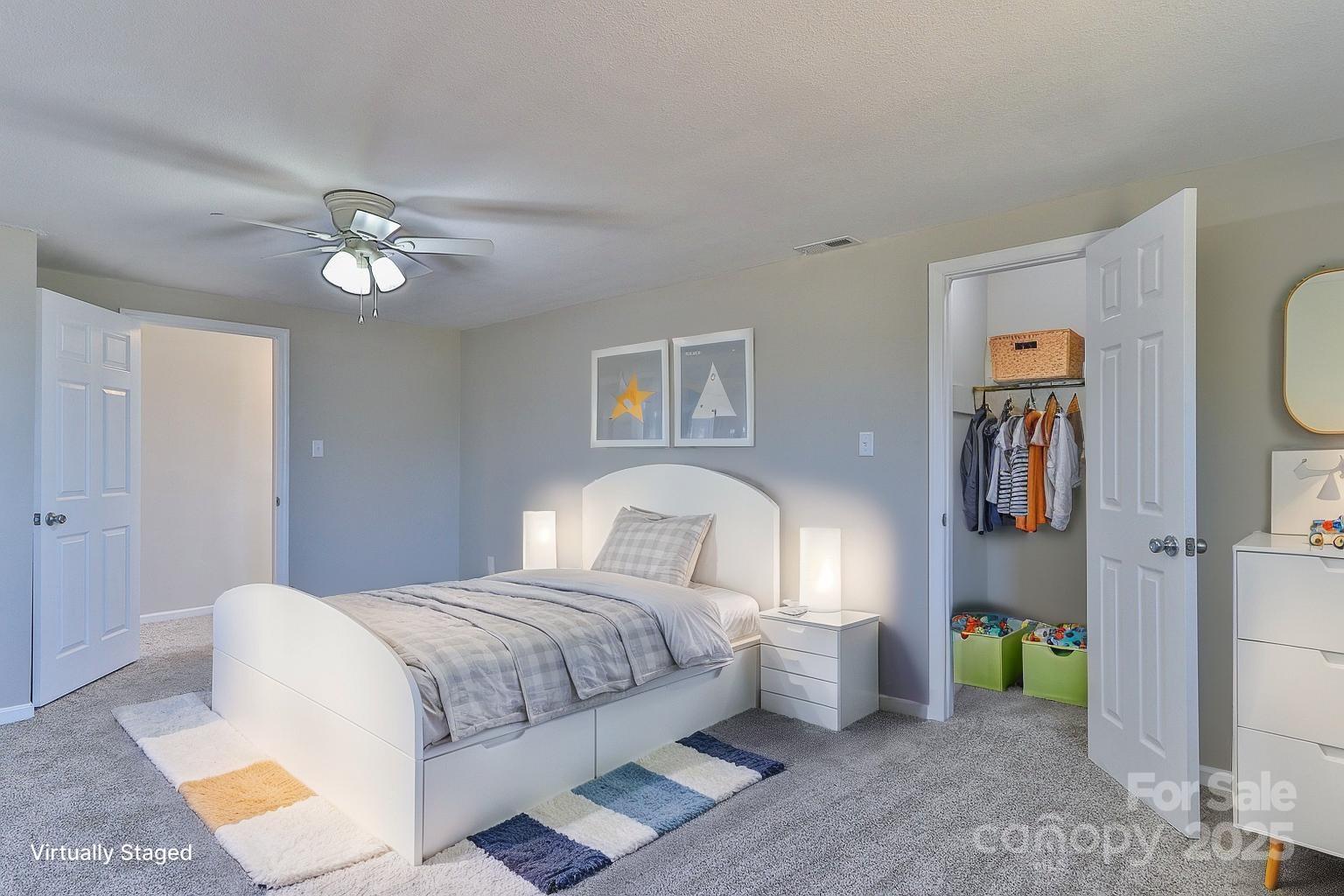 3424 Walker Circle Lenoir, NC 28645 - Photo 31 of 38 a bedroom with a bed and a chandelier