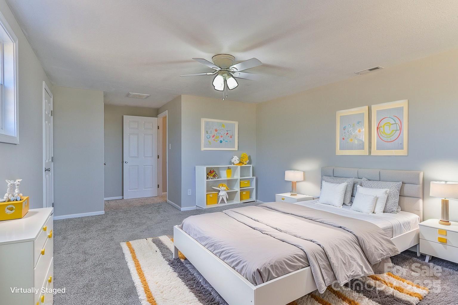 3424 Walker Circle Lenoir, NC 28645 - Photo 34 of 38 a bedroom with a bed and a chandelier