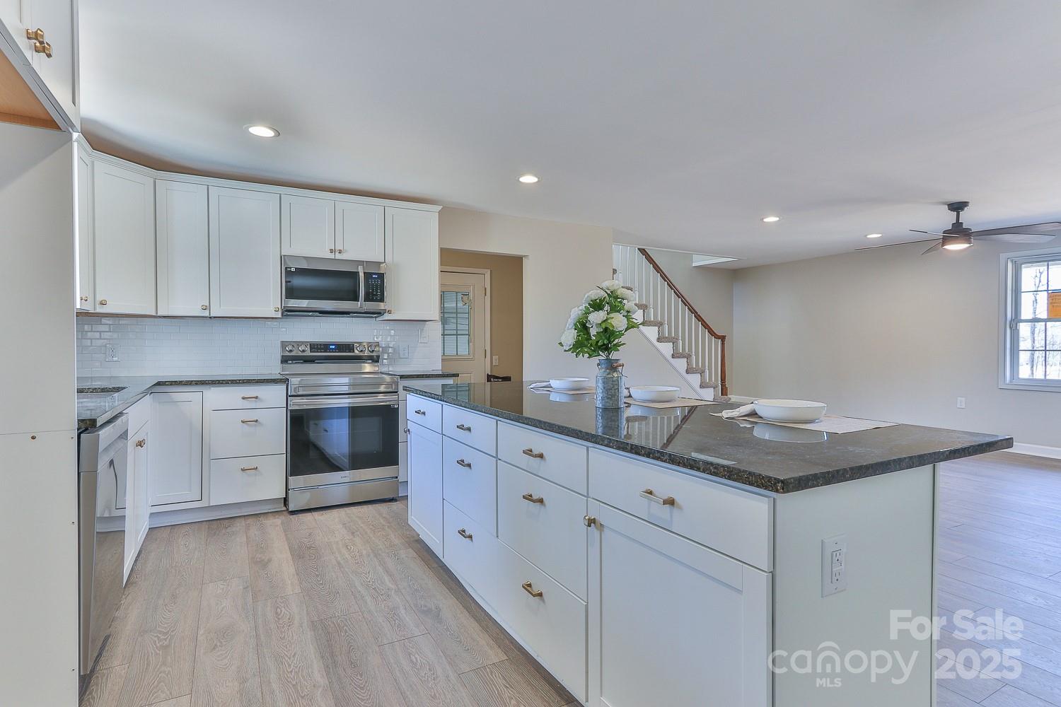 3424 Walker Circle Lenoir, NC 28645 - Photo 6 of 38 a kitchen with appliances a sink and cabinets