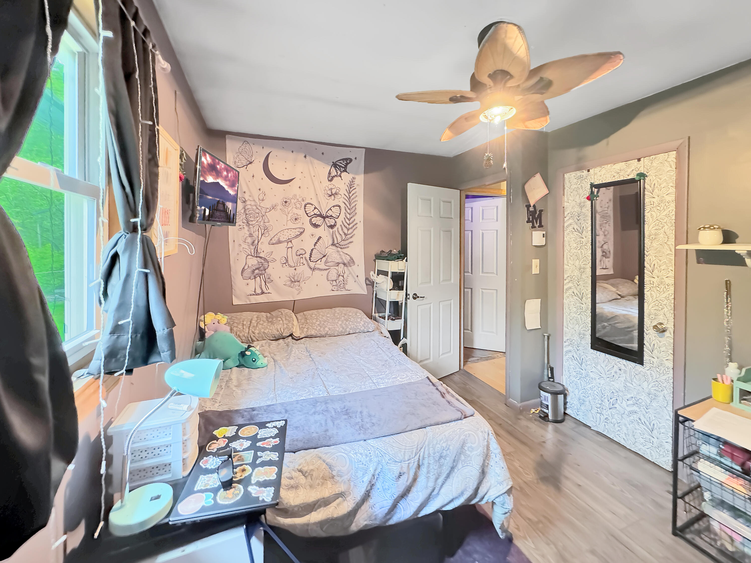 163 Granite Road Long Pond, PA 18334 - Photo 12 of 19 a bedroom with a bed a chandelier and flat screen tv