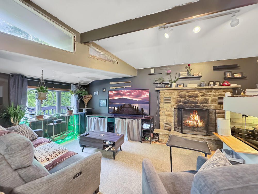 163 Granite Road Long Pond, PA 18334 - Photo 4 of 19 a living room with furniture and a fireplace