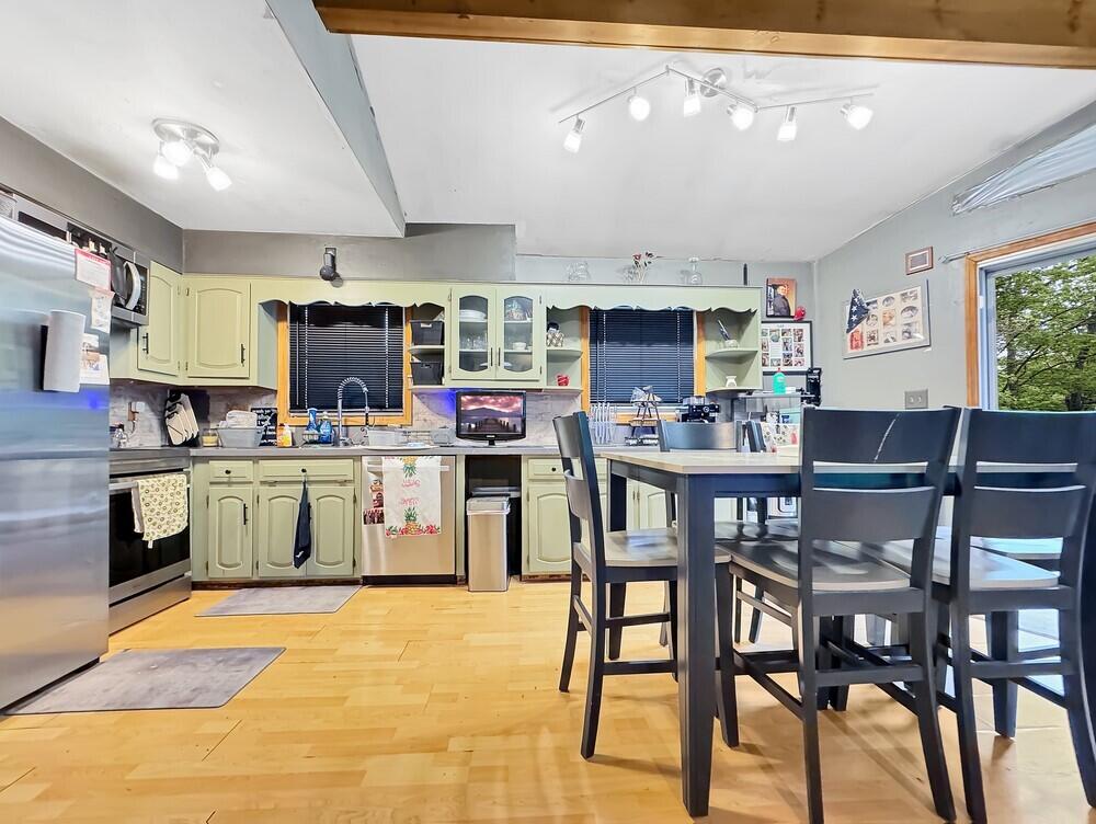 163 Granite Road Long Pond, PA 18334 - Photo 6 of 19 a kitchen with a table chairs stove and cabinets