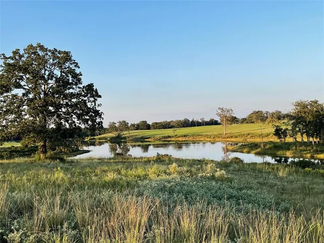 a backyard of a house with table and chair