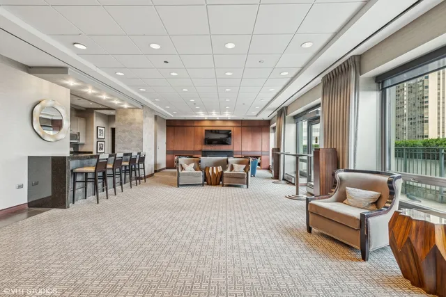 a view of a dining room with furniture window and outside view
