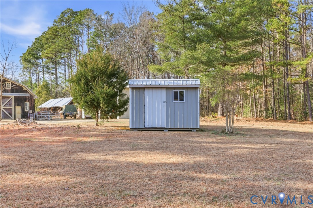6606 West Quaker Road Disputanta, VA 23842 - Photo 2 of 32 View of yard with nicely sized shed