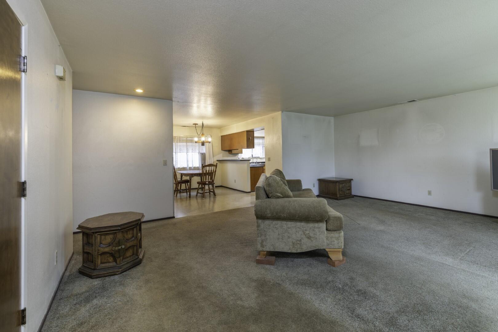 3305 Cessna Drive Redding, CA 96001 - Photo 4 of 15 a living room with furniture and a table