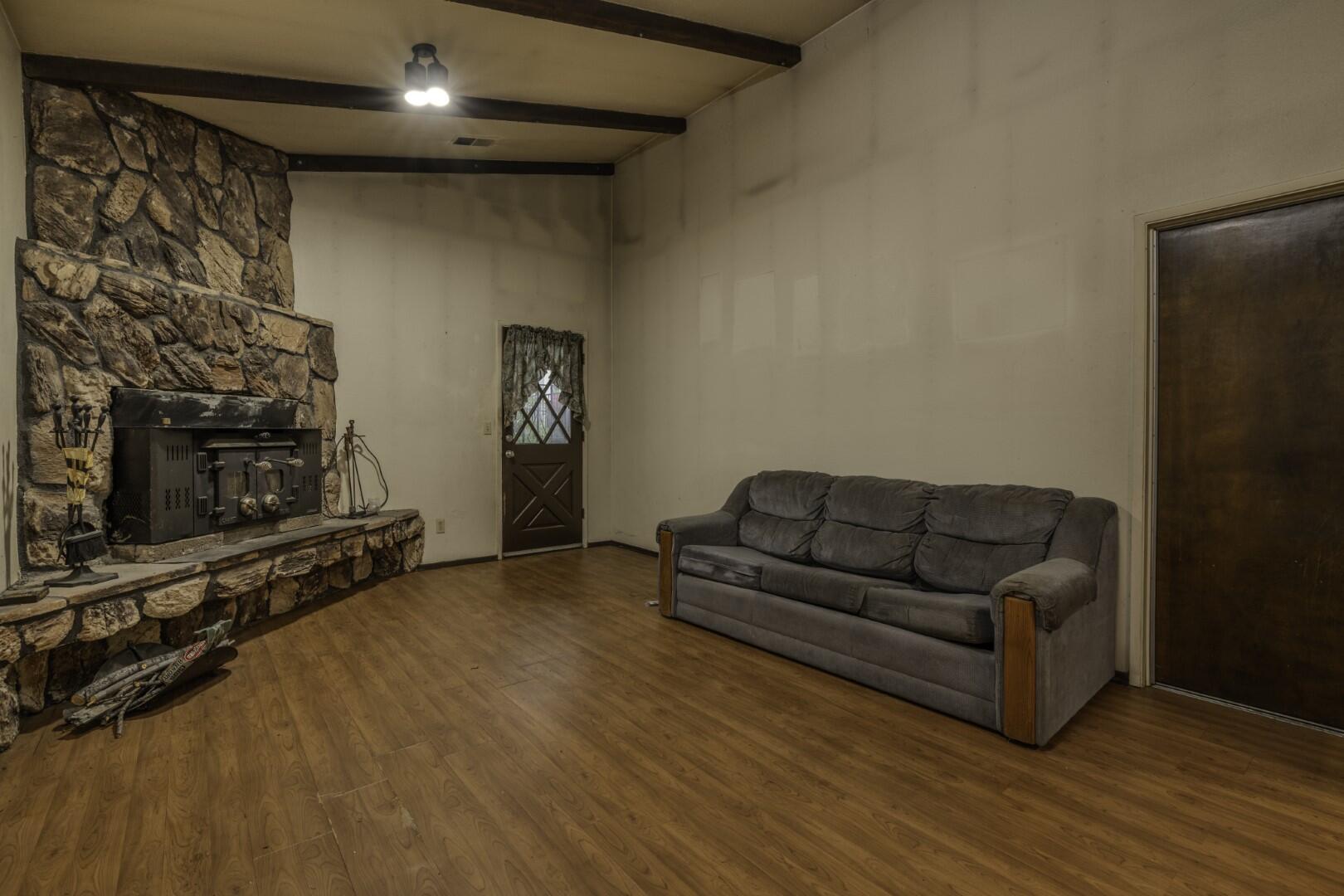 3305 Cessna Drive Redding, CA 96001 - Photo 9 of 15 a living room with furniture a flat screen tv and a fireplace