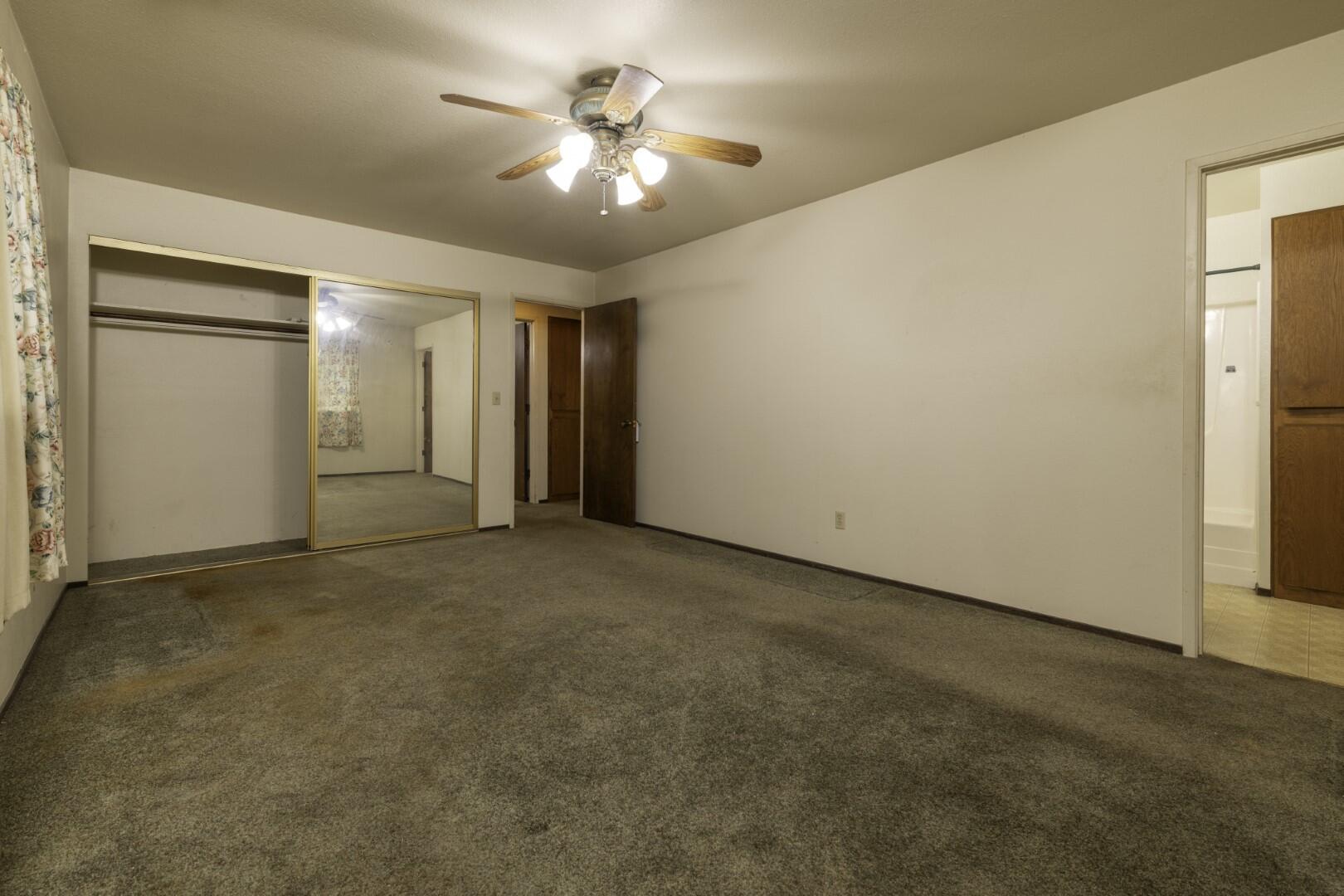 3305 Cessna Drive Redding, CA 96001 - Photo 10 of 15 a view of an empty room with a chandelier fan