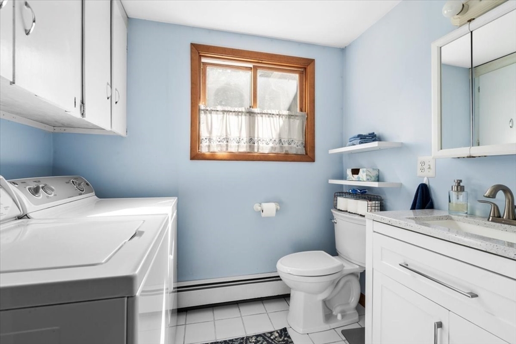 31 Lawton Road Shirley, MA 01464 - Photo 23 of 37 a bathroom with a toilet sink and mirror