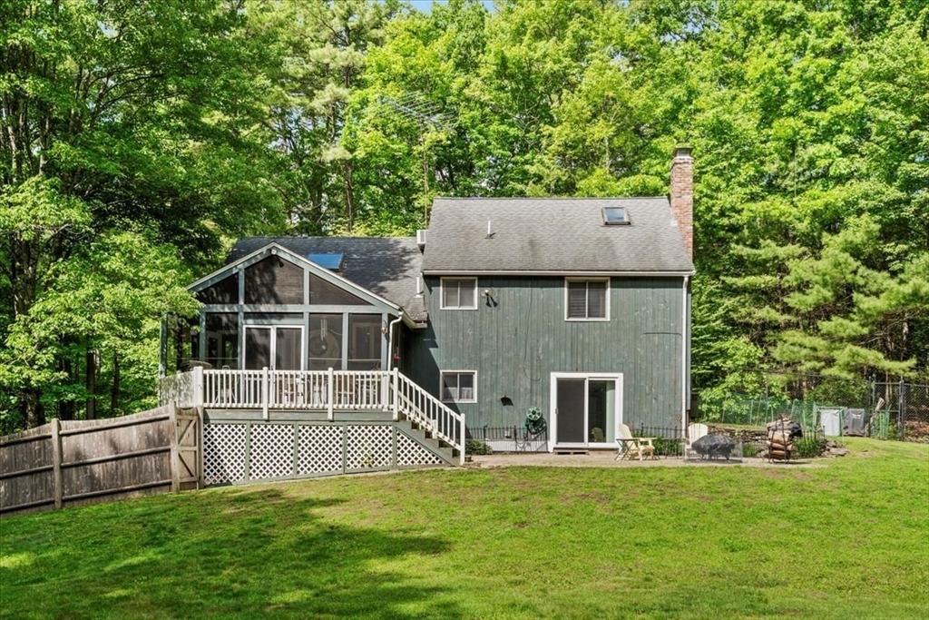 31 Lawton Road Shirley, MA 01464 - Photo 33 of 37 a front view of a house with a yard