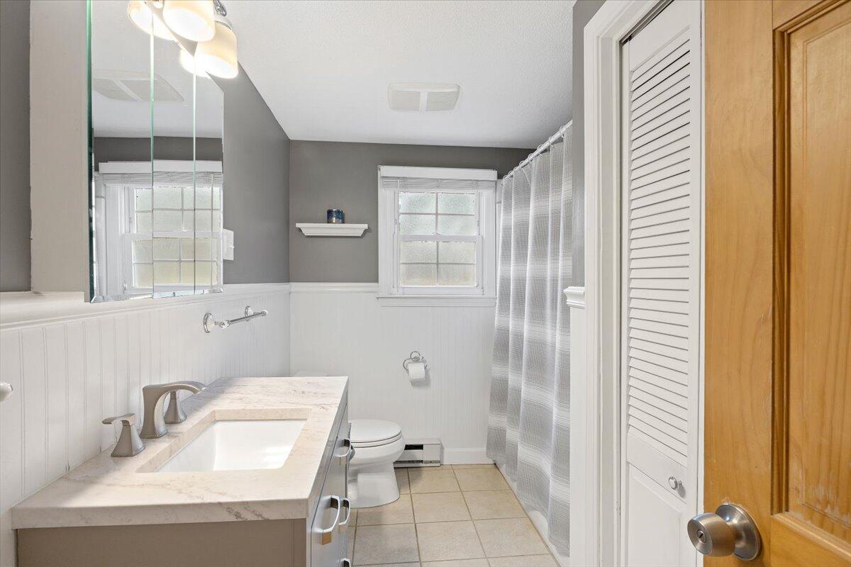 24 Regency Drive Sagamore, MA 02561 - Photo 12 of 27 a bathroom with a sink a toilet and shower