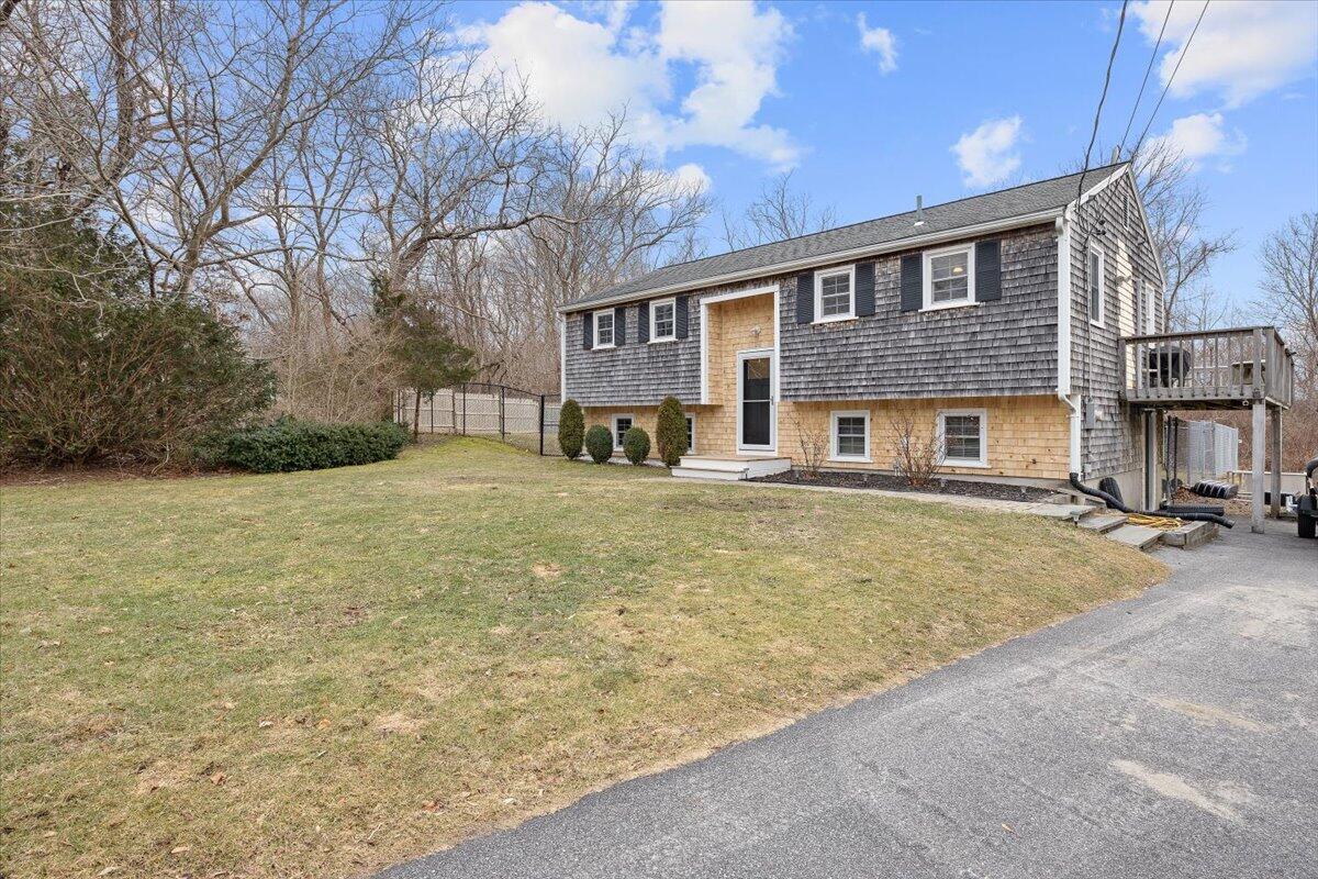 24 Regency Drive Sagamore, MA 02561 - Photo 3 of 27 a front view of house with yard