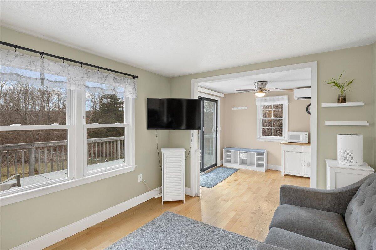 24 Regency Drive Sagamore, MA 02561 - Photo 6 of 27 a living room with furniture and a flat screen tv