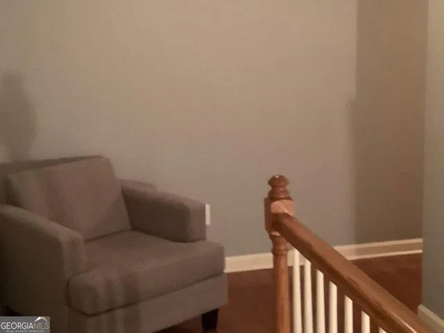 a bed sitting in a bedroom next to a wooden door