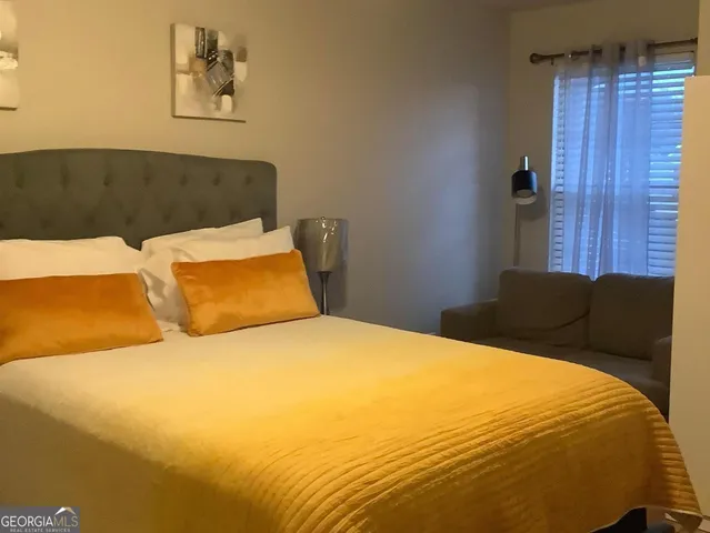 a bathroom with a sink and curtain