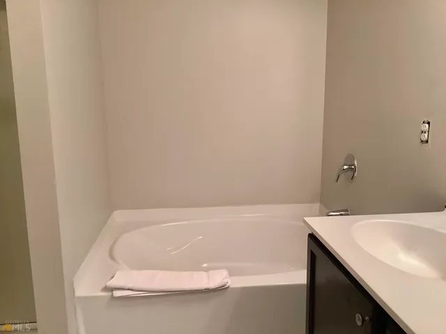 a bathroom with a glass shower door