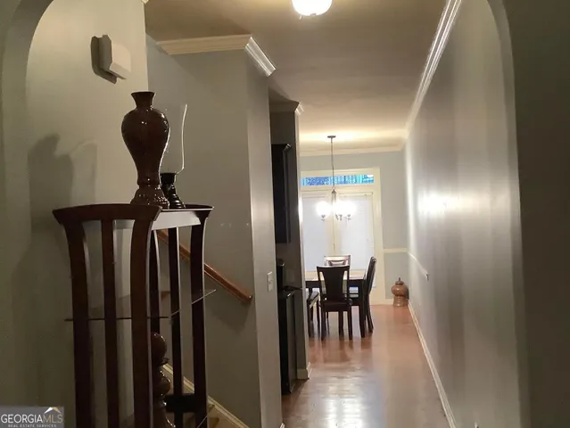 a view of a hallway with chairs