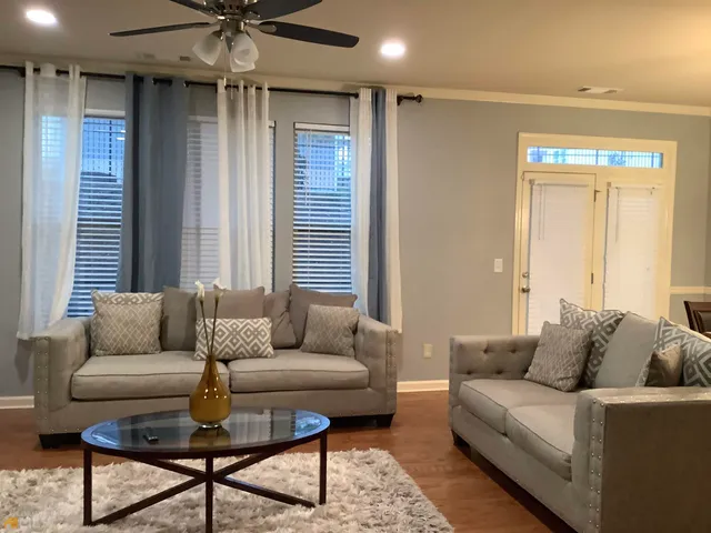 a living room with furniture and a window