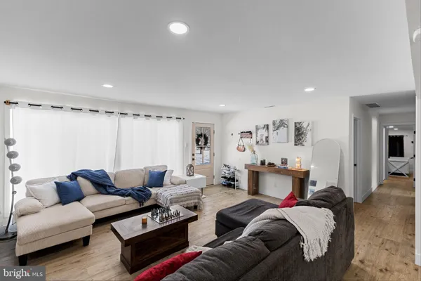 a living room with furniture and a table