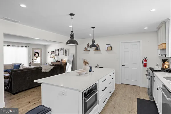 a kitchen with a sink and stove