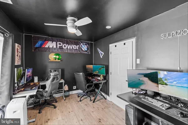 a view of a kitchen with kitchen appliances and a counter top space