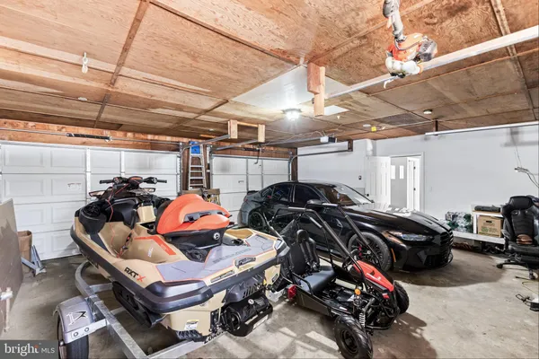 a view of a garage with parked cars