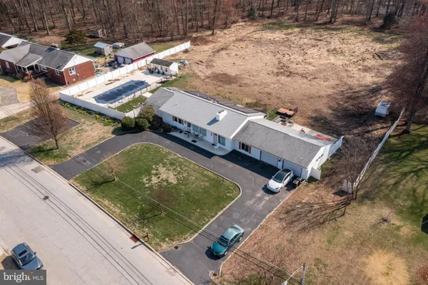 an aerial view of residential house with outdoor space