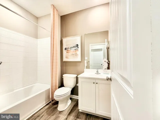 a bathroom with a toilet a sink and a bathtub