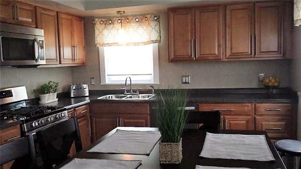 443 Routh Street Monroeville, PA 15146 - Photo 5 of 13 Included in the recently remodel large Eat-in-Kitchen is the ceramic tile backsplash and new vinyl floor (looks like ceramic tile floor). All stainless steel appliances are included.