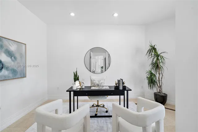 a living room with furniture and a clock